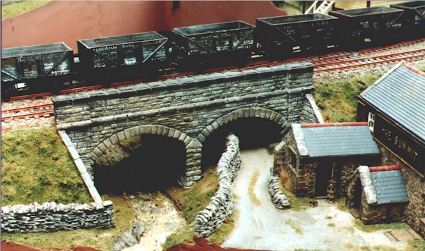  Note the typical, almost paintless 50's wooden 
 coal wagons.  Replaced by the steel 
 16 tonner they were all gone by the 60's! 